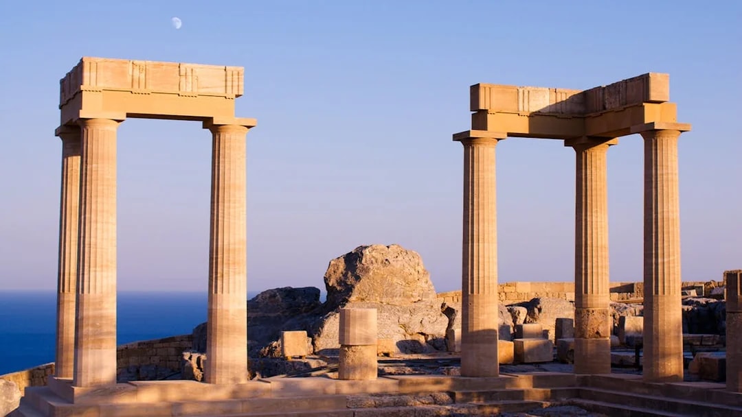 Ancient columns at Acropolis of Lindos with sea view, Rhodes, Greece.