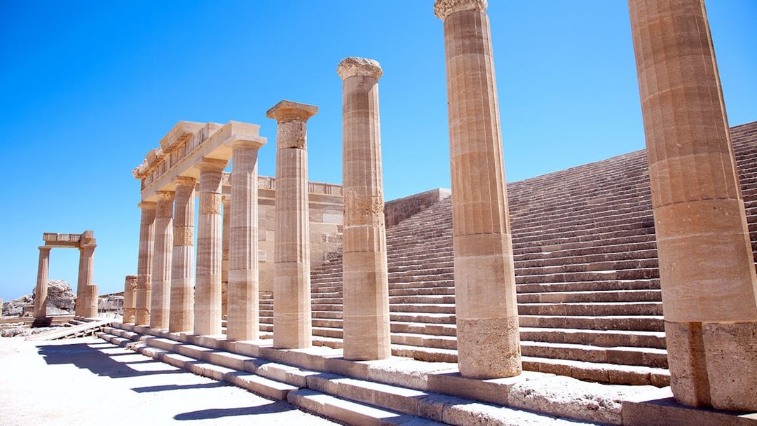 Ancient columns and steps at the Acropolis of Lindos in Greece.