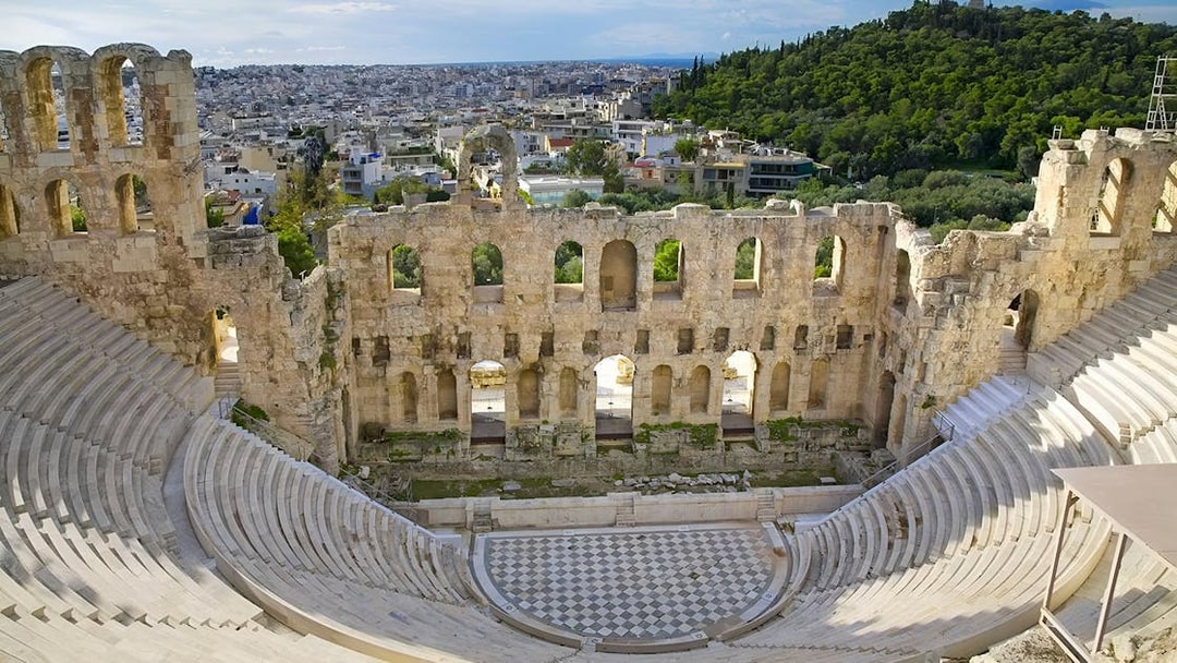 Odeon of Herodes Atticus amphitheater with cityscape view, Athens, Greece.