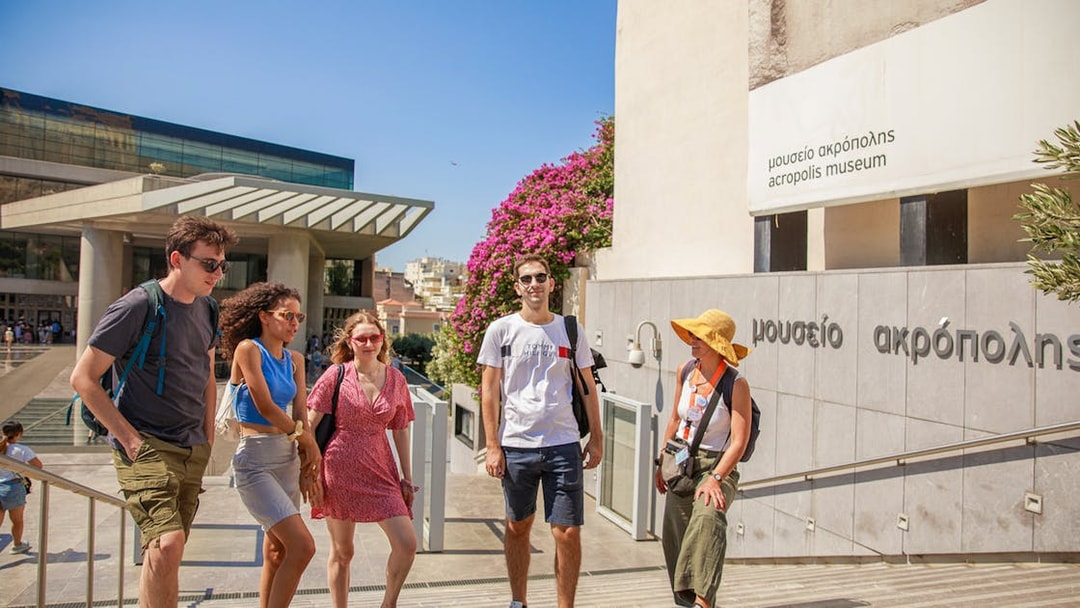 Visitors on a guided tour outside the Acropolis Museum in Athens.