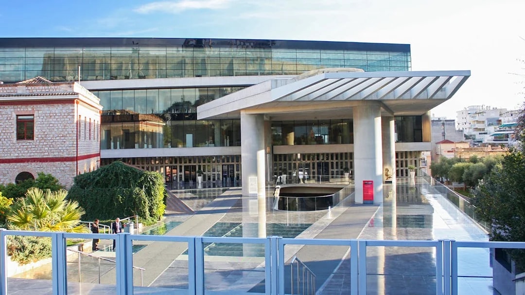 Acropolis Museum entrance in Athens, Greece with modern architecture and glass facade.