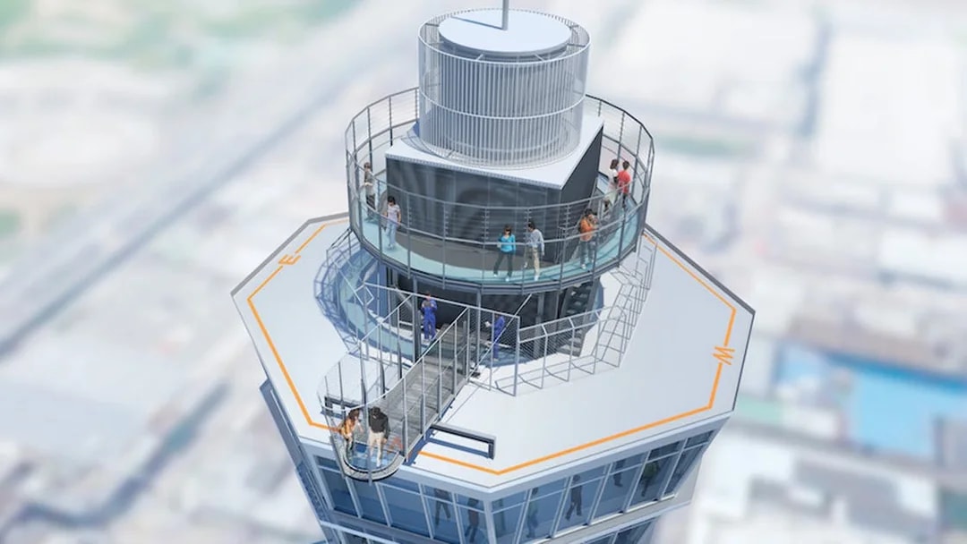 Visitors on the observation deck of Tsutenkaku Tower, Osaka, Japan.