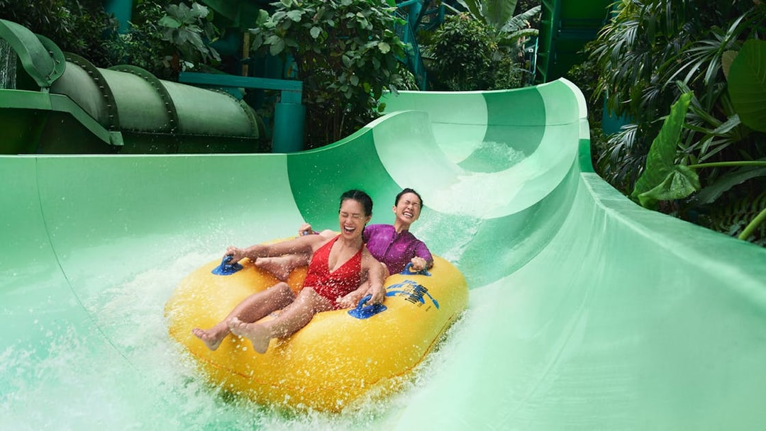 Visitors on the Pipeline Plunge ride at Adventure Cove Waterpark, Singapore.