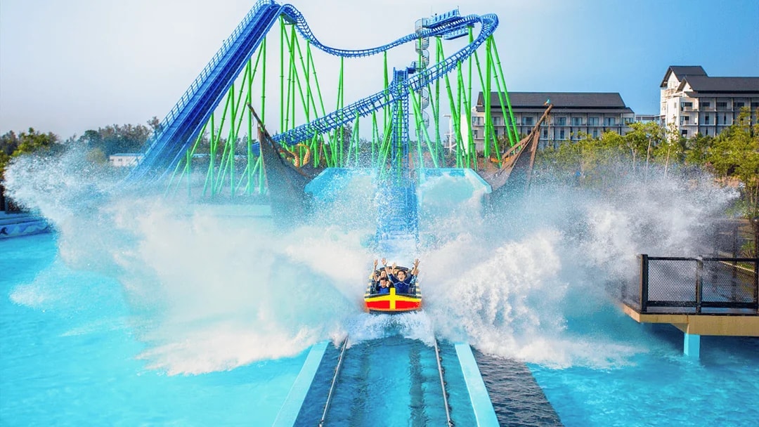 Desaru water coaster splashing at Adventure Waterpark with riders enjoying the thrill.