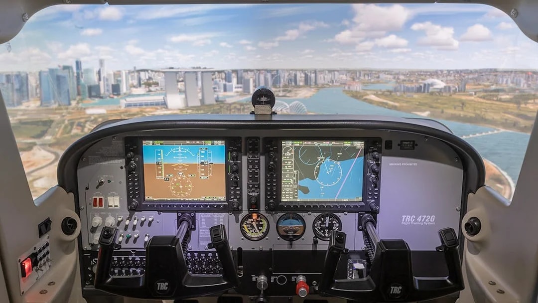 Cockpit view of flight simulator with Singapore skyline in background.