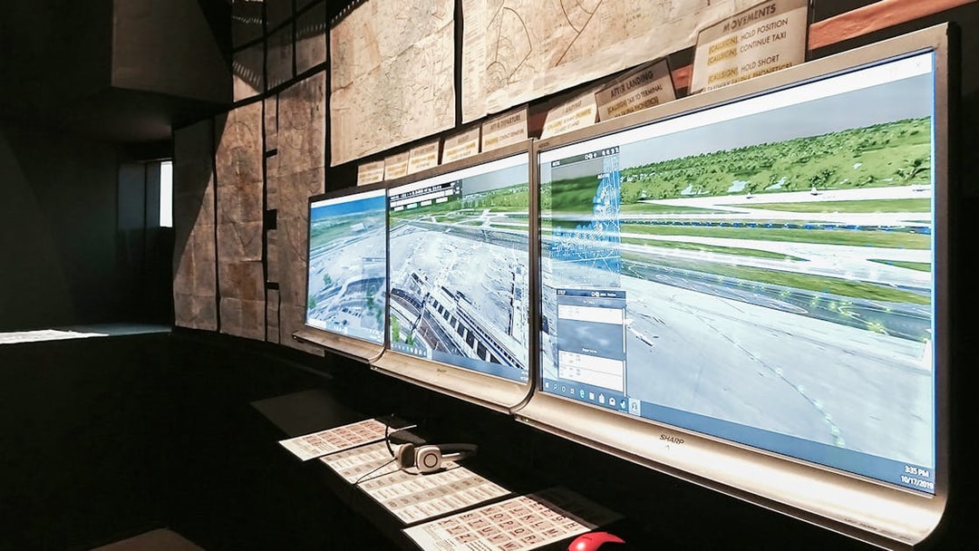 Flight simulator screens displaying airport runway for Aeroviation Full Flight Experience.