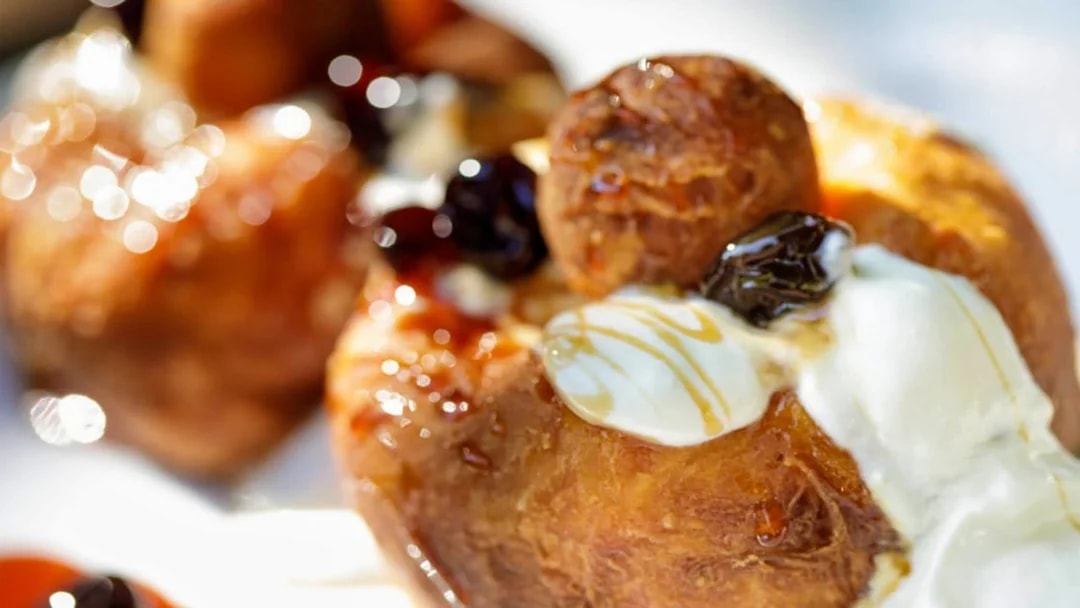 Traditional dessert with cream and syrup served on the After Dark City Tour.