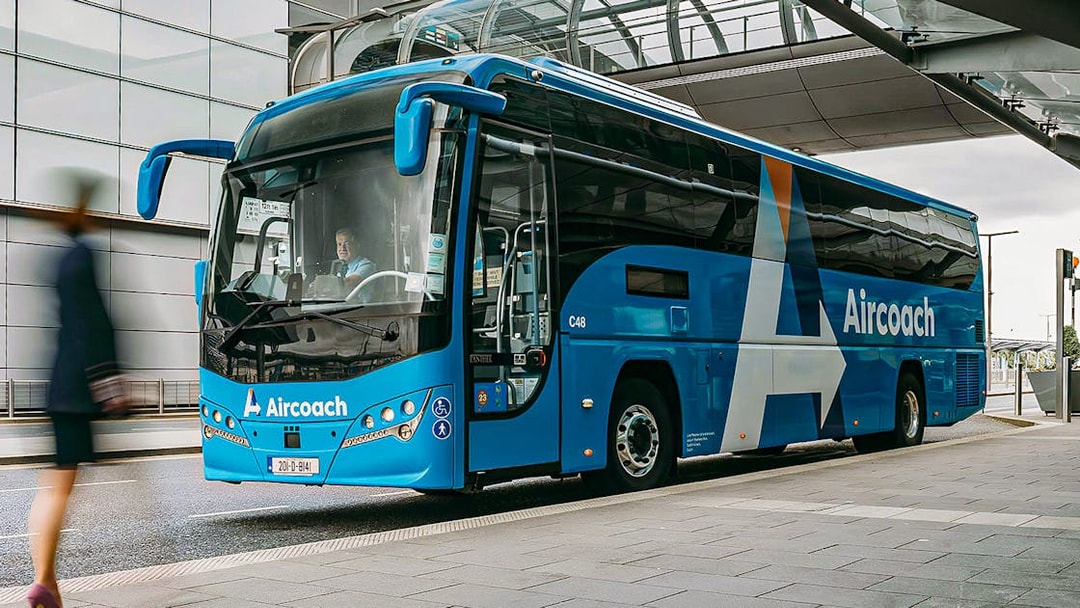 Dublin Aircoach bus at airport terminal for Dublin Airport transfers.