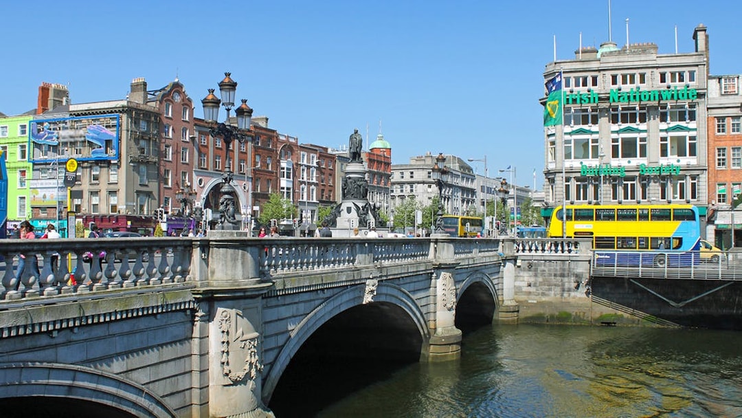 O'Connell Bridge over River Liffey with Dublin cityscape in the background.