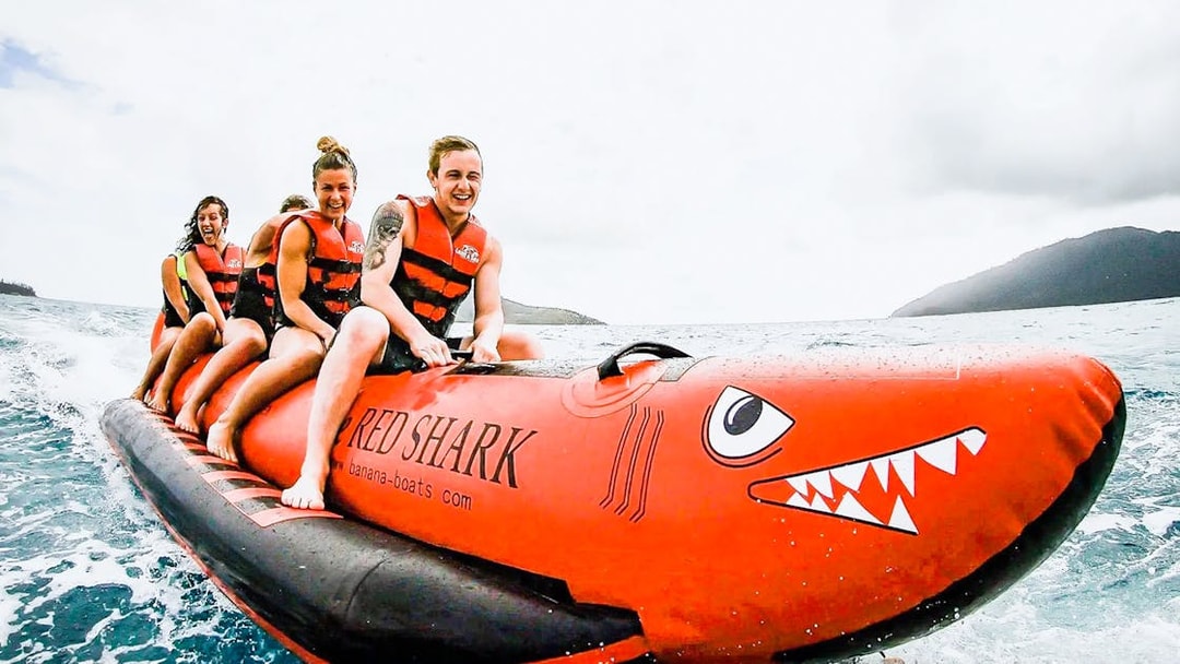 Tourists riding a banana boat in the Whitsundays.