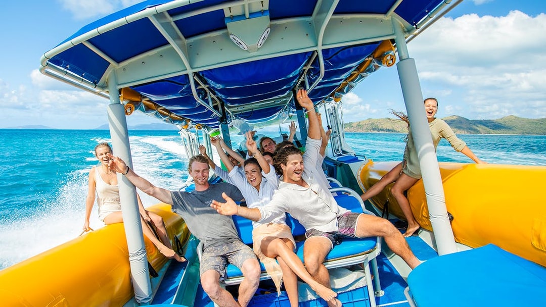 Group enjoying a boat ride on Whitsundays snorkel cruise from Airlie Beach.
