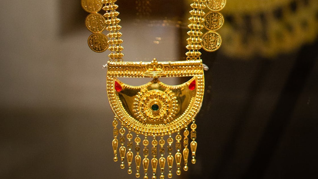 Gold necklace with intricate designs at Al Shindagha Museum, Dubai.
