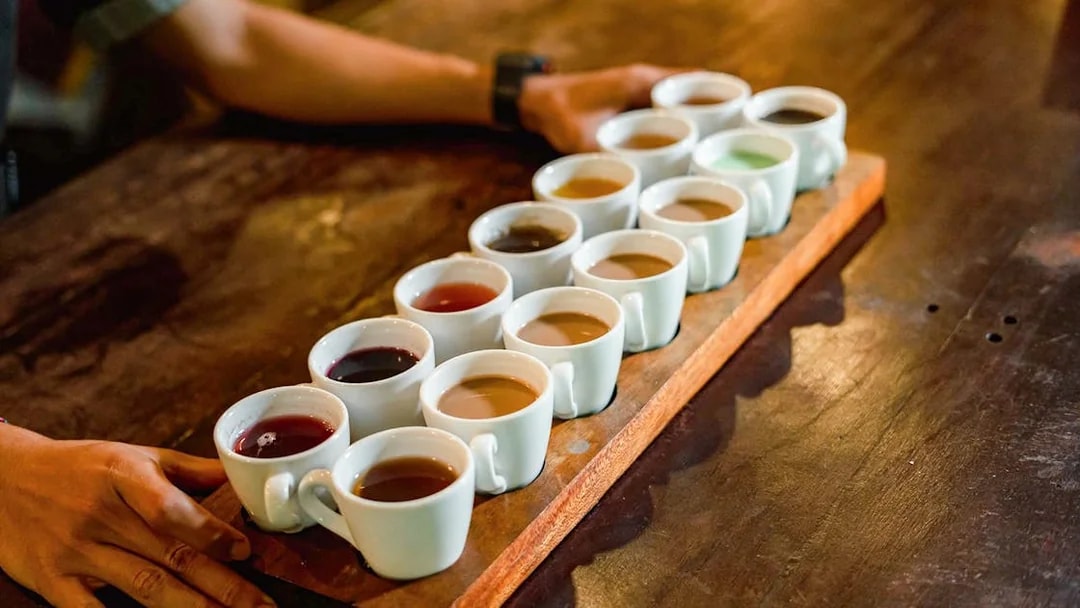 Coffee tasting samples on a wooden tray at Alas Harum, Bali.