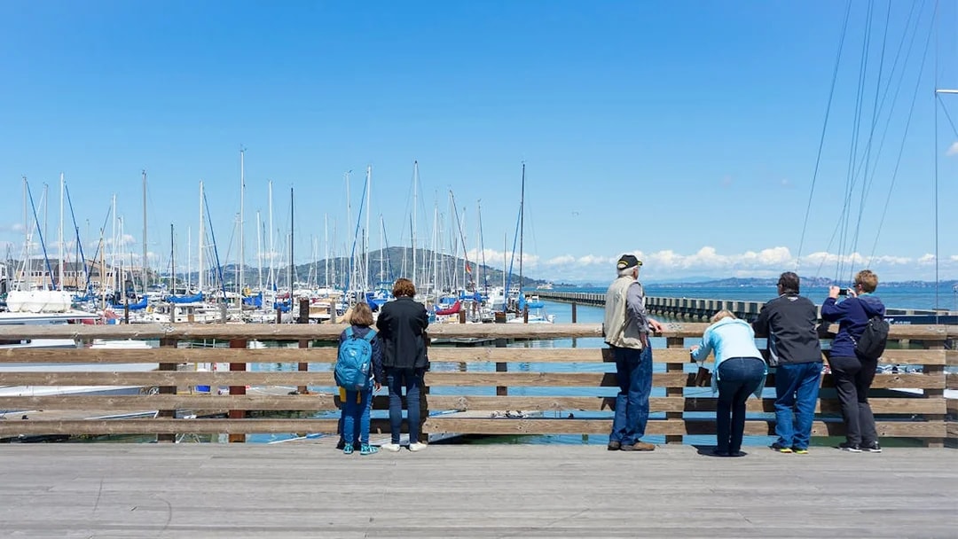 Guests viewing yachts at Pier 39 Marina, San Francisco, CA.