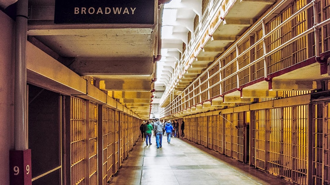 Alcatraz cell block corridor with visitors on Fisherman’s Wharf Walking Tour.