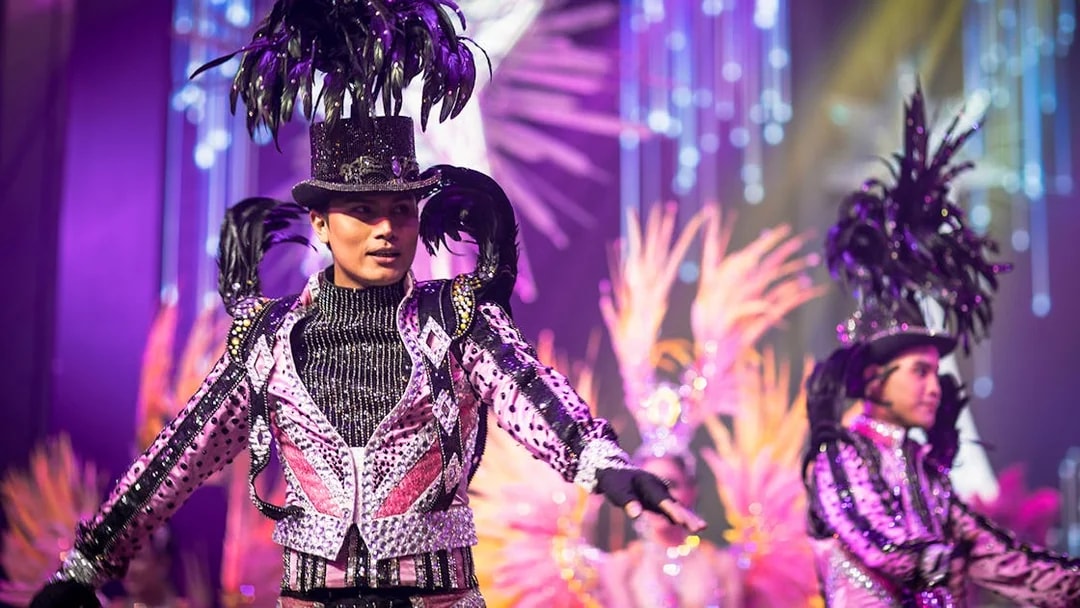 Performers in vibrant costumes at Alcazar Cabaret Show, Pattaya.