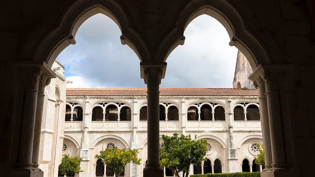Cloister arches and courtyard at Alcobaça Monastery, Portugal.