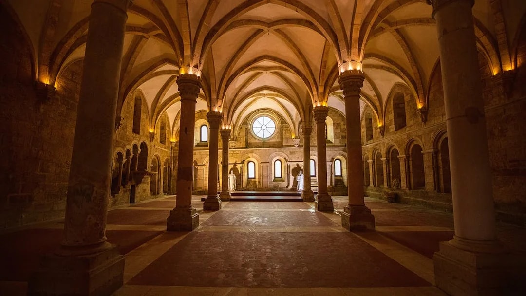 Dinning hall with vaulted ceilings and columns at Alcobaça Monastery, Portugal.