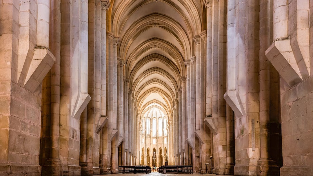 Alcobaça Monastery interior with vaulted arches and stone columns, Portugal.