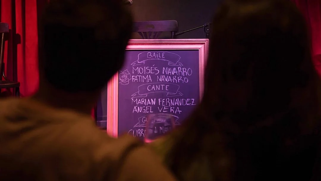 Chalkboard listing performers at Alegría Flamenco & Gastronomia event.