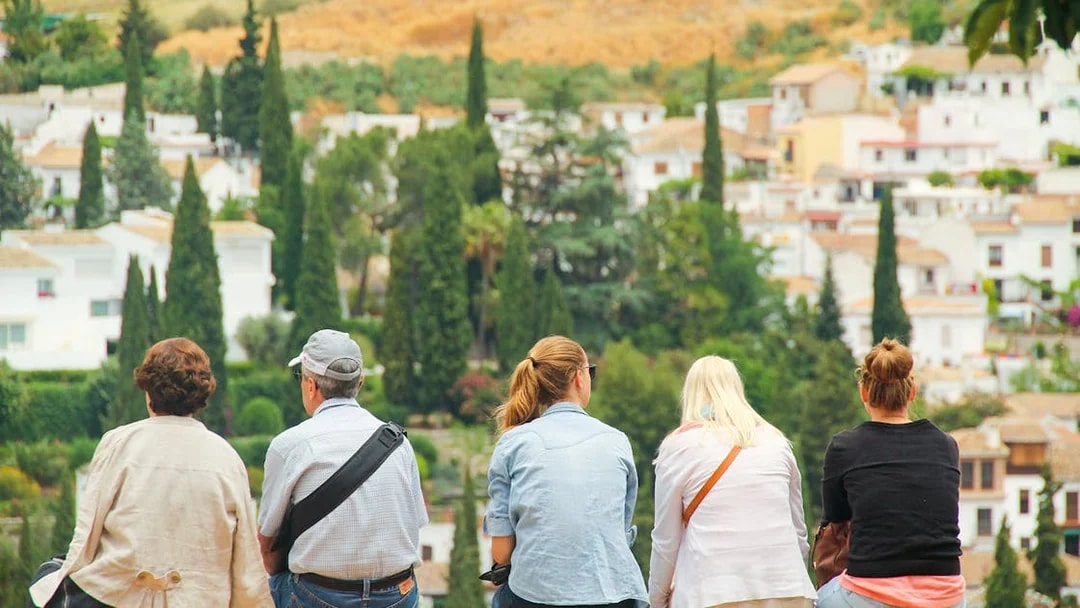 Group enjoying view of Alhambra, Granada with guide.