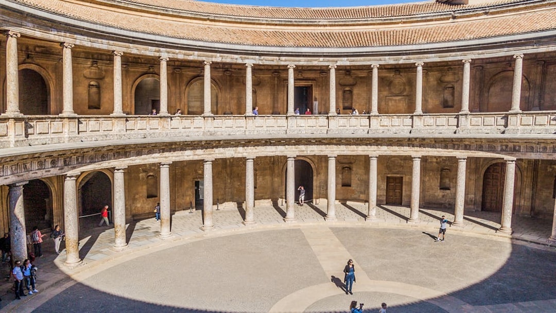Alhambra's circular courtyard with columns in Granada, Spain.