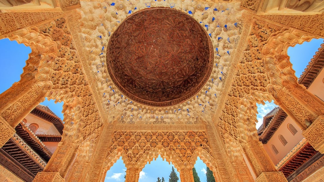 Alhambra's intricate ceiling in the Court of the Lions, Granada.