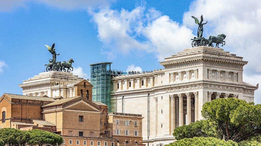 Altare della Patria with glass elevator and rooftop view in Rome, Italy.