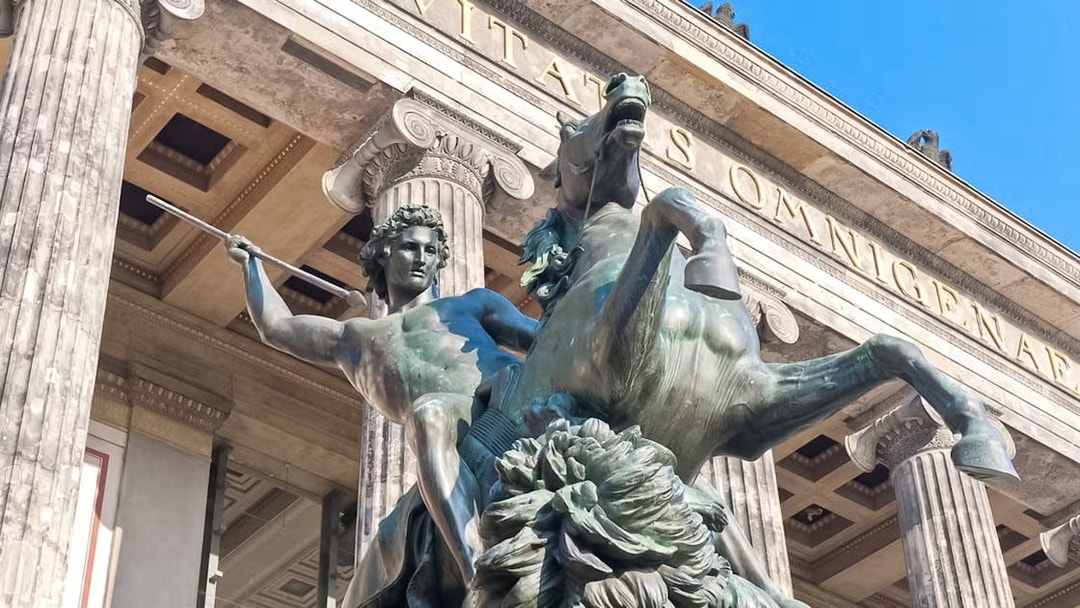 Statue of a warrior on horseback at Altes Museum entrance, Berlin.