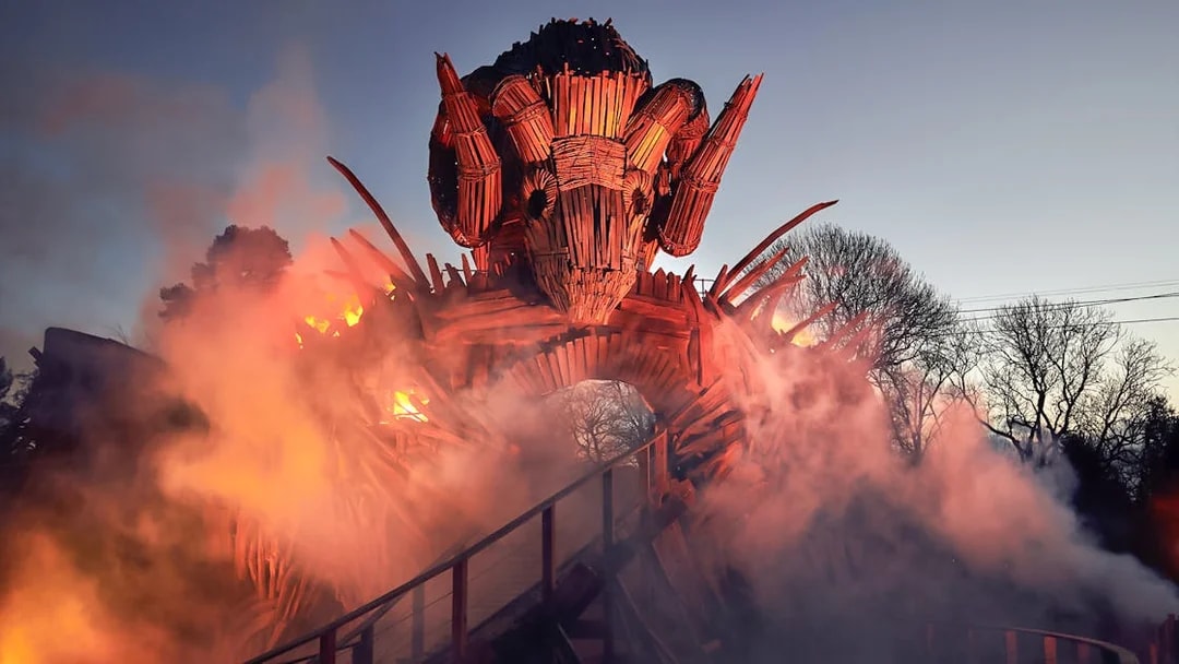 Wicker Man ride structure with flames and smoke at Alton Towers.