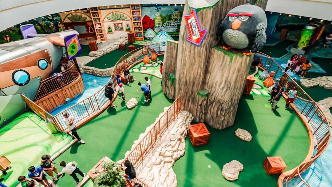 Mini golf course at Angry Birds American Dream with themed obstacles and players.