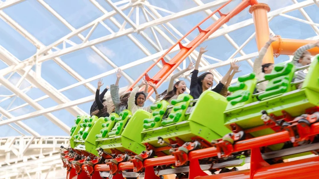 Riders enjoying a roller coaster at American Dream Nickelodeon Universe.