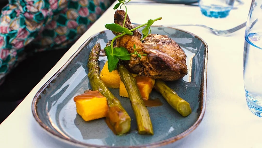 Grilled chicken with asparagus and polenta on Amsterdam dinner cruise.