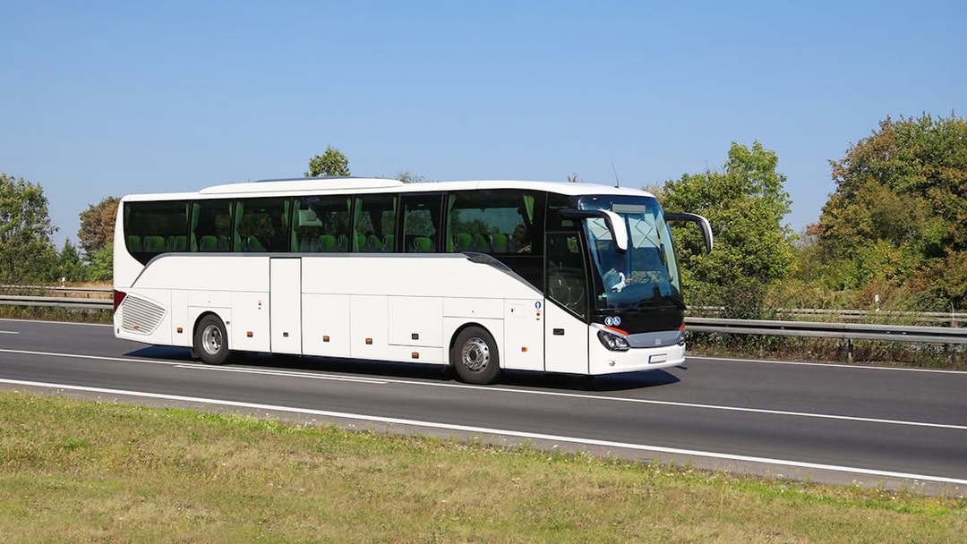 Tour bus on highway for Amsterdam to Zaanse Schans, Edam, Volendam, Marken tour.