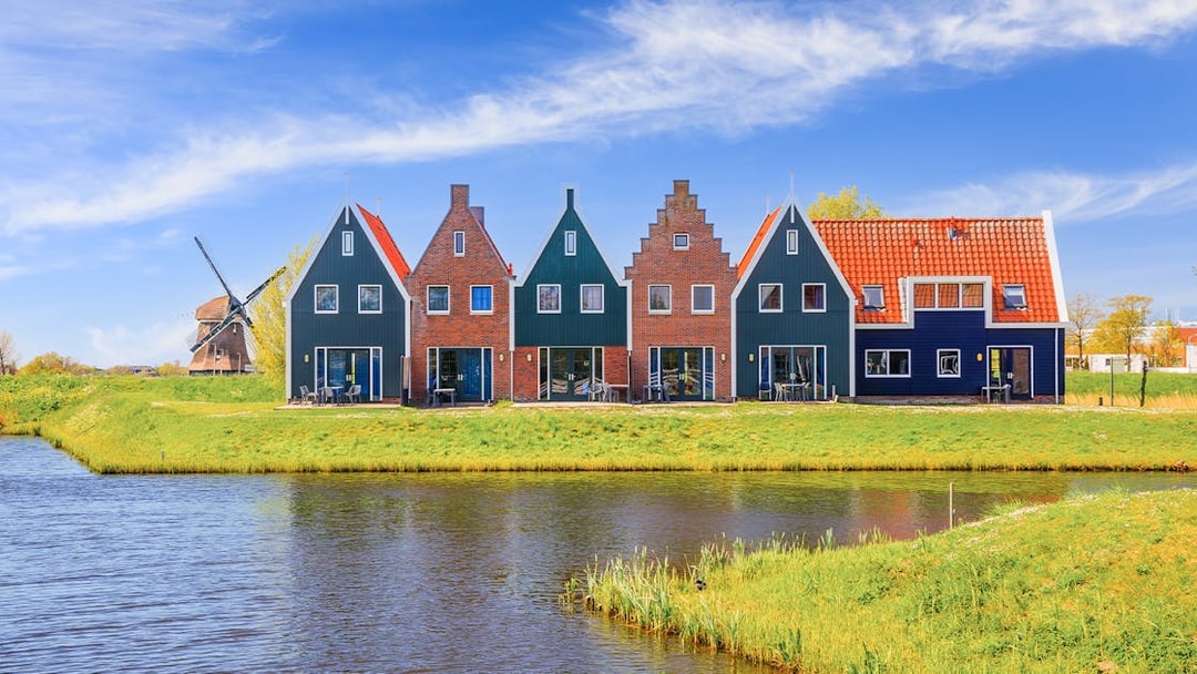 Traditional Dutch houses and windmill in Zaanse Schans, Netherlands.