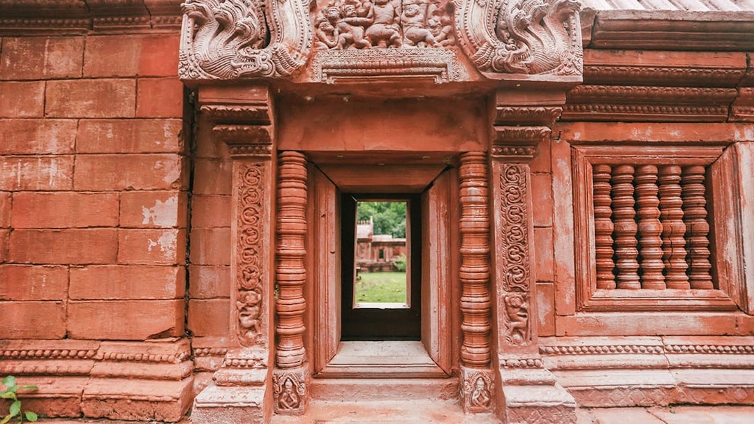 Ornate stone doorway at Ancient City on Erawan Museum tour, Thailand.