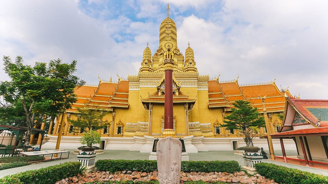 Golden temple facade at Ancient City, Thailand, featured on the Erawan Museum Guided Tour.