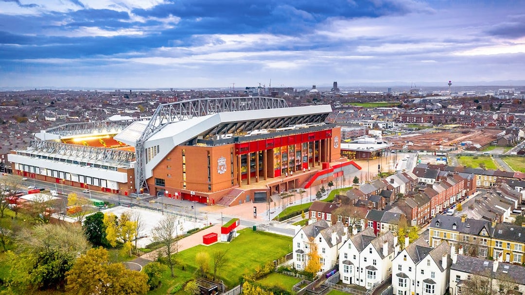 Aerial view of Anfield Stadium in Liverpool surrounded by residential area.