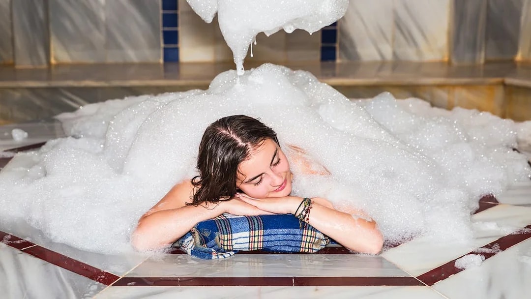 Relaxing in a foam-filled Turkish bath in Antalya.