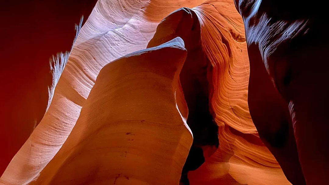 Antelope Canyon X sandstone formations with light filtering through.