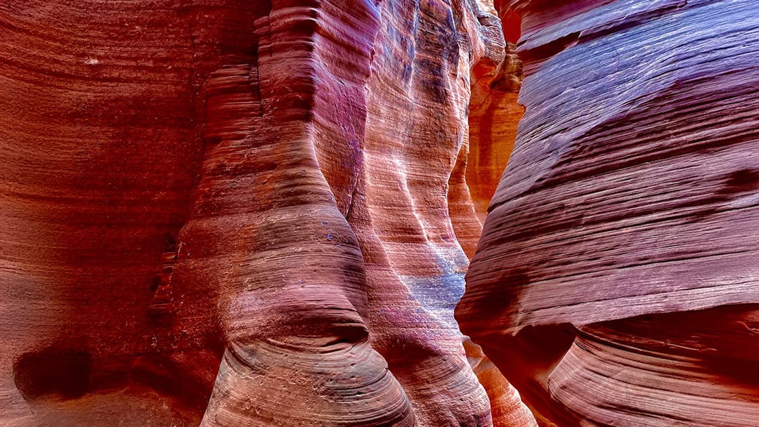 Antelope Canyon X sandstone formations with vibrant colors and light patterns.