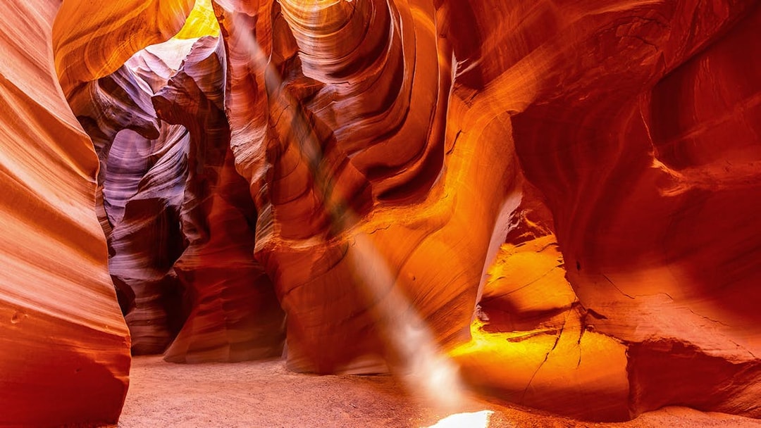 Upper Antelope Canyon sandstone formations with light beams in Arizona.
