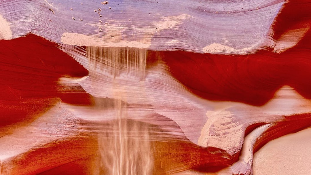 Antelope Canyon X sandstone formations with light beams in Arizona.