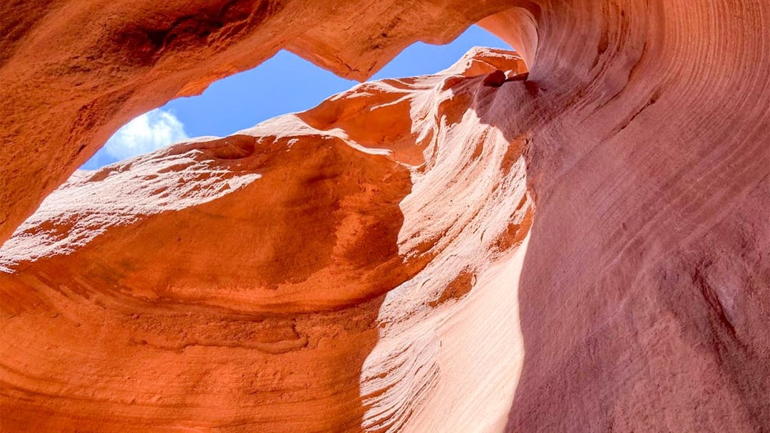 Antelope Valley Canyon rock formations under blue sky on Ligai Si Anii Tour.