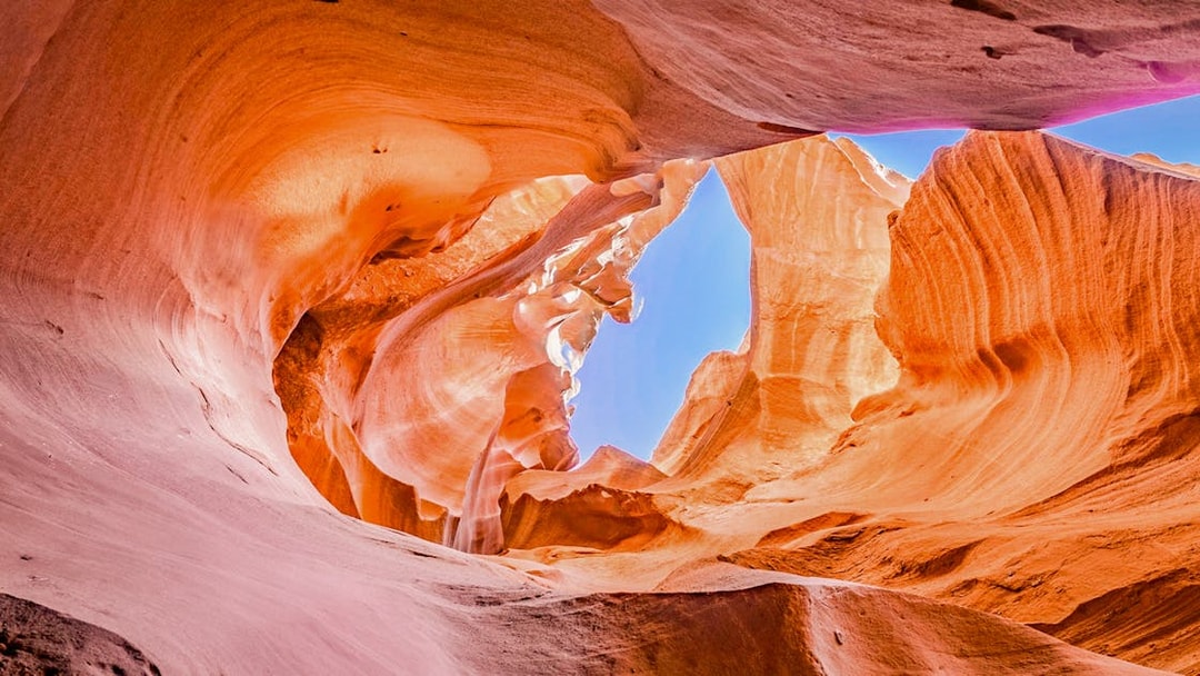 Antelope Valley Canyon rock formations with sunlight filtering through, Ligai Si Anii Tour.