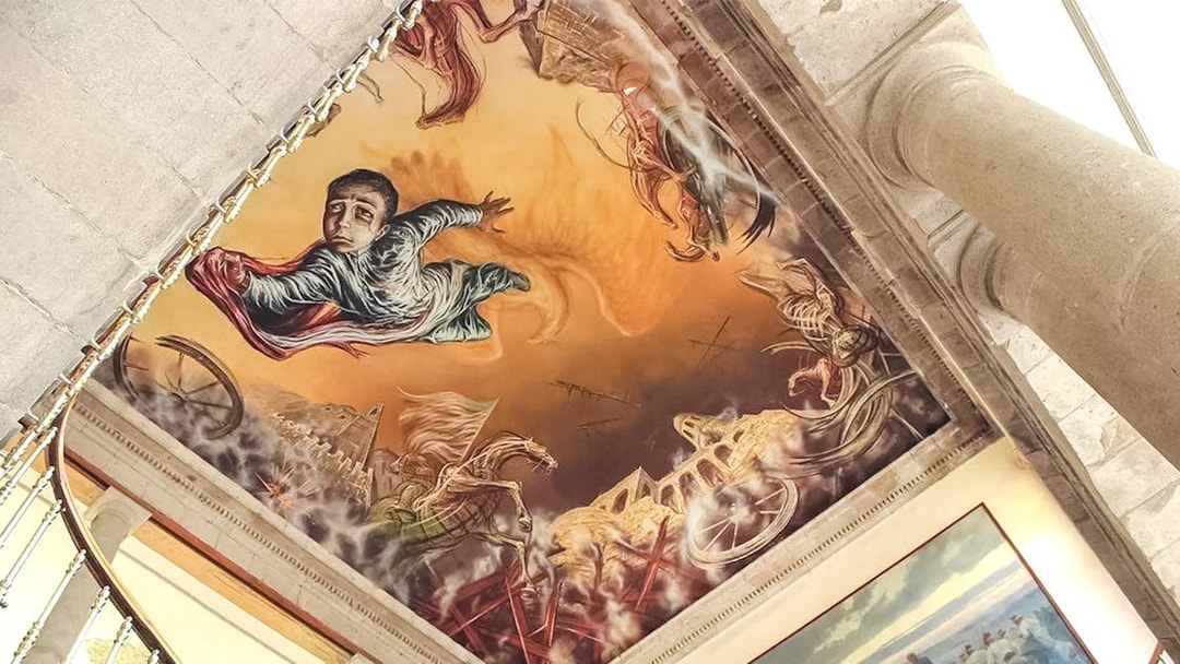 Chapultepec Castle ceiling mural with historical Mexican figures and vibrant artwork, Mexico City.
