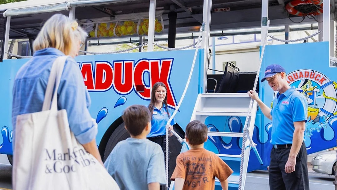 Guests boarding Aquaduck vehicle for city tour and river cruise.