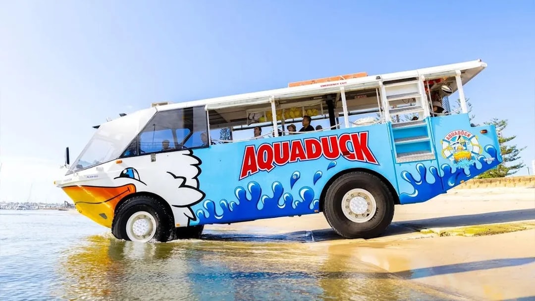 Aquaduck amphibious vehicle entering water on Sunshine Coast city tour and river cruise.