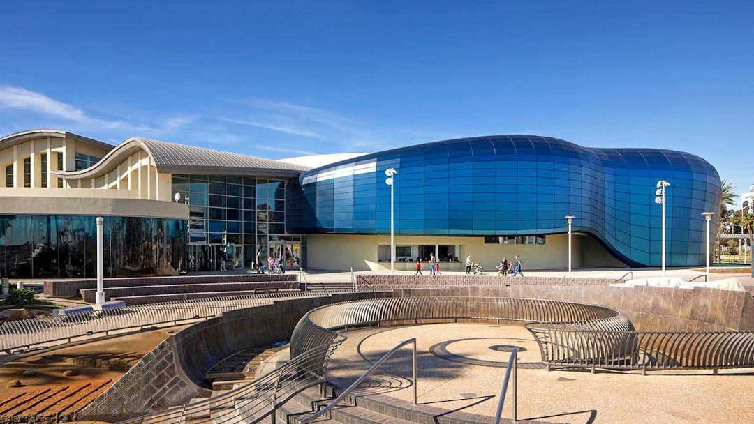 Aquarium of the Pacific entrance with visitors entering, Long Beach, California.