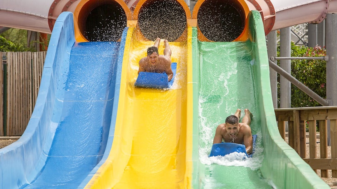 Visitors enjoying water slides at Aquasplash Antibes.